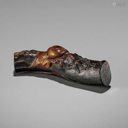 A FINE UMIMATSU NETSUKE OF A SNAIL ON A BRANCH, ATTRIBUTED T...