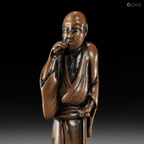 【†】 HOKYUDO ITSUMIN: A FINE WOOD NETSUKE OF A BLIND MAN CLEA...