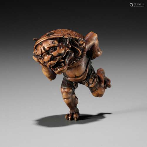 【†】 A WOOD NETSUKE OF AN ONI AT SETSUBUN, ATTRIBUTED TO ROKK...