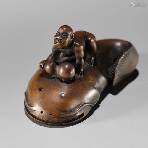 MUGAI: A RARE WOOD NETSUKE OF A BLIND FISHERMAN TAMING THE N...