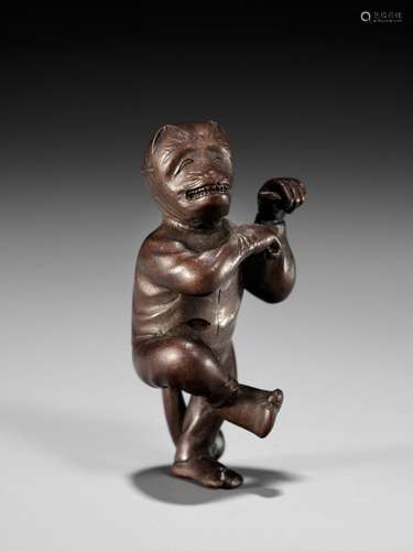 AN EXQUISITELY SMALL WOOD NETSUKE OF A FOX DANCER, ATTRIBUTE...