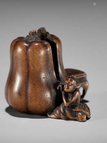 NAOYUKI: AN EXQUISITE MINIATURE WOOD NETSUKE OF A NIO CUTTIN...