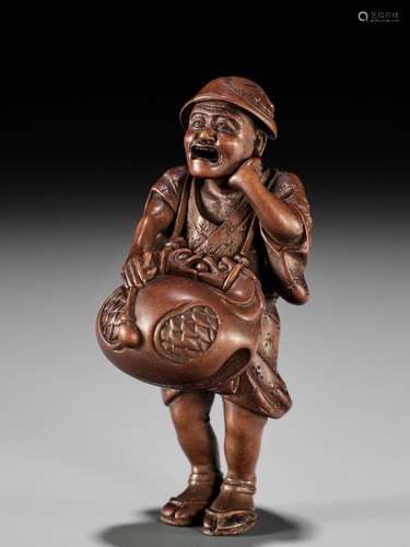 OUCHI GYOKUSO: A VERY FINE SO SCHOOL WOOD NETSUKE OF A TEMPL...