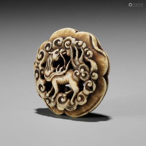 【†】 A STAG ANTLER RYUSA MANJU NETSUKE OF A KIRIN AMONGST CLO...