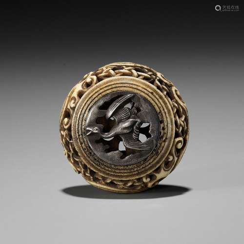 【†】 A STAG ANTLER AND SHIBUICHI KAGAMIBUTA NETSUKE DEPICTING...