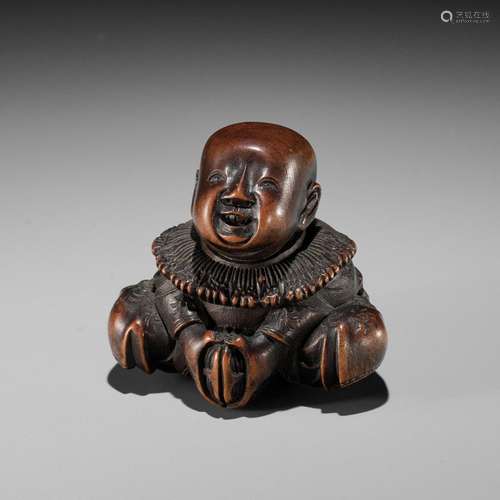 MASAYUKI: A FINE WOOD NETSUKE OF A BOY