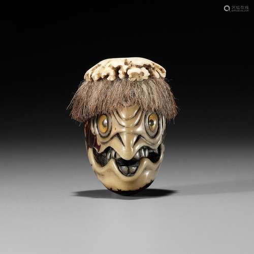 HAKUSAI: A RARE COROZO NUT AND STAG ANTLER NETSUKE OF A KAPP...