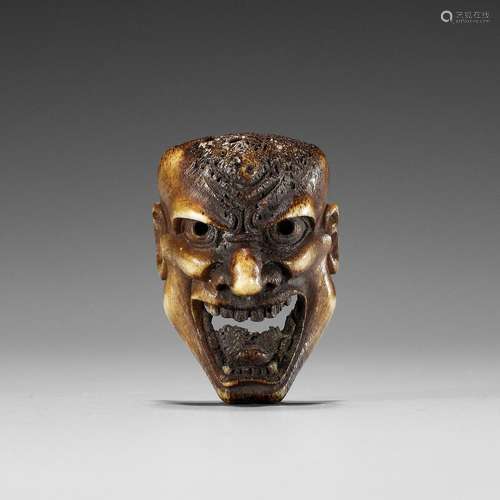 A SUPERB STAG ANTLER MASK NETSUKE OF HANNYA