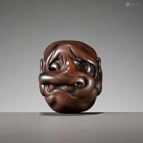 AN AMUSING WOOD MASK NETSUKE OF A LONG-NOSED TENGU