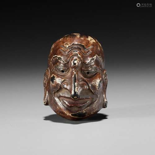 A LACQUERED WOOD GIGAKU MASK NETSUKE OF CHIDO