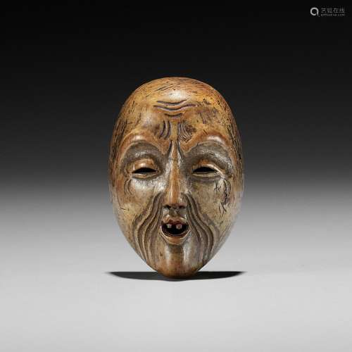 A LACQUERED WOOD MASK NETSUKE OF KOJO