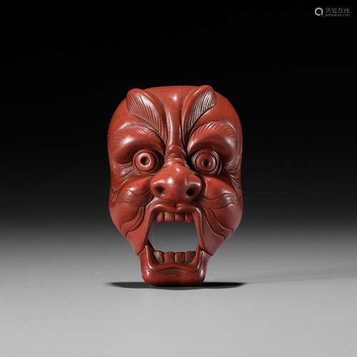 JOKO: A RARE TSUISHU (RED LACQUER) BUGAKU MASK NETSUKE OF GE...