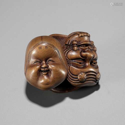 SOSHI: A FINE JOSO SCHOOL WOOD MASK NETSUKE OF A GROUP OF MA...