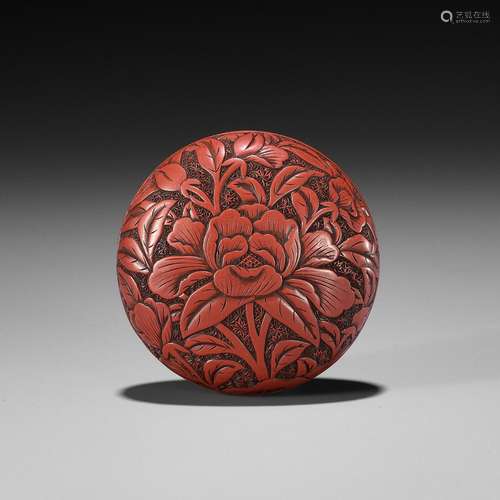 A FINE TSUISHU LACQUER MANJU NETSUKE WITH PEONIES