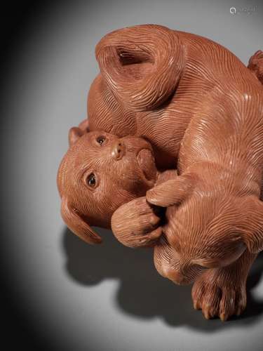 【†】 NICK LAMB: A WOOD NETSUKE OF TWO PUPPIES AT PLAY