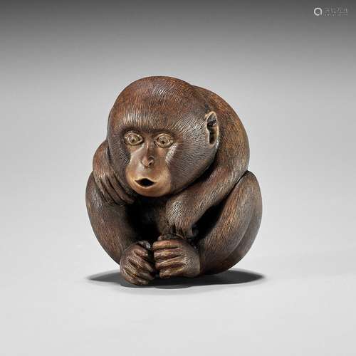 SHION: A WOOD NETSUKE OF A MONKEY