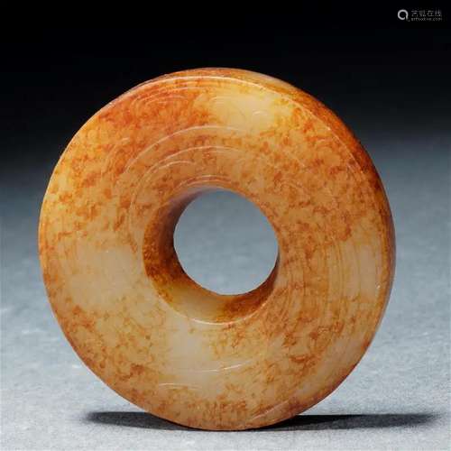 A Chinese Incised Archaistic Jade Disc Bi