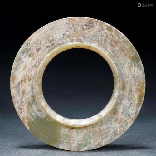 A Chinese Carved Celadon Jade Bi