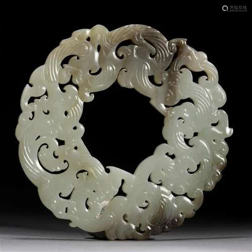 A Chinese Carved Jade Dragon and Phoenix Pendant