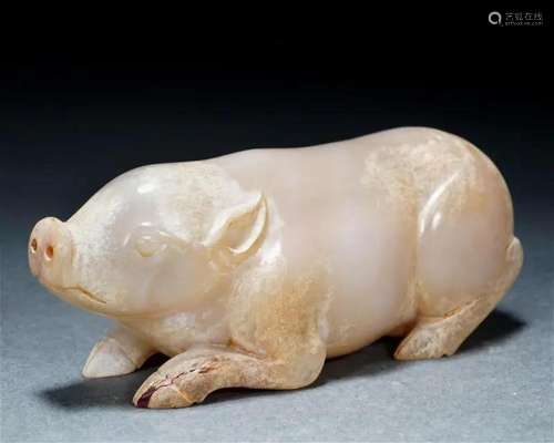 A Chinese Carved White Jade Pig