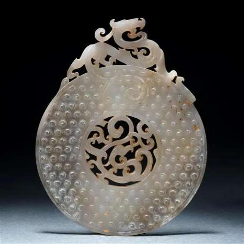 A Chinese Archaistic Carved Jade Disc Bi