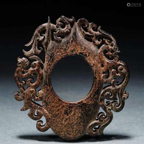 A Chinese Archaistic Carved Jade Ornament She