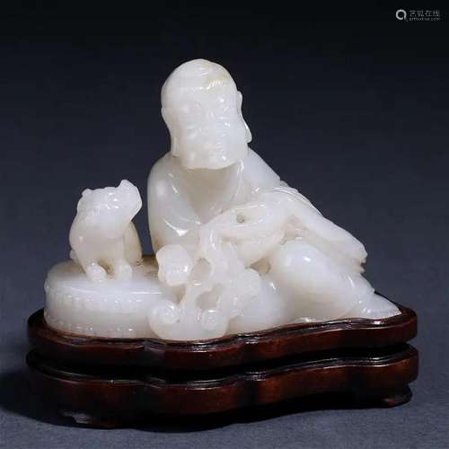 A Chinese Carved White Jade Luohan