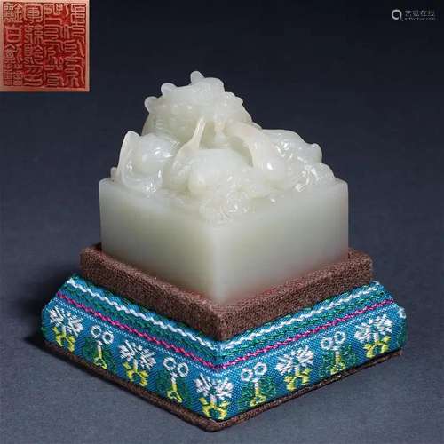 A Chinese Carved White Jade Dragon Seal