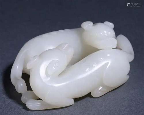 A Chinese Carved White Jade Double