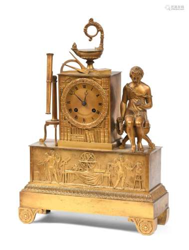 Pendule en bronze ciselé et doré à décor des attributs de la...