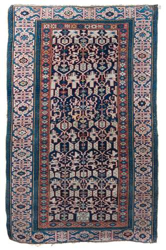 Ancien tapis du Caucase en laine à fond bleu marine et à déc...