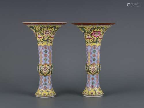 A pair of yellow-ground famille rose goblets with banana lea...