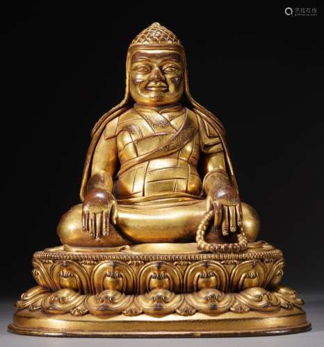 17/18th C. Gilt-bronze figure of a Seated Guru