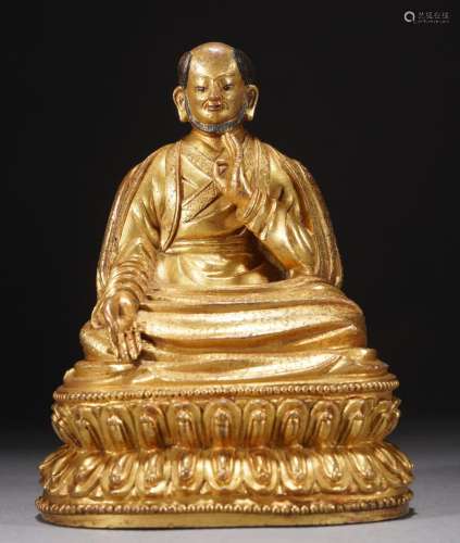 Antique Gilt bronze figure of a seated guru