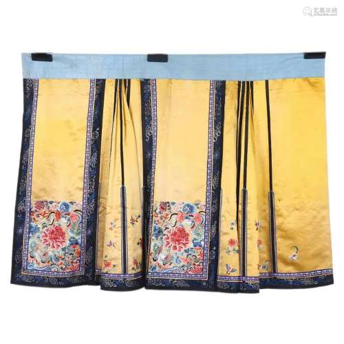 A YELLOW SATIN SKIRT WITH MULTICOLORED EMBROIDERY OF BUTTERF...