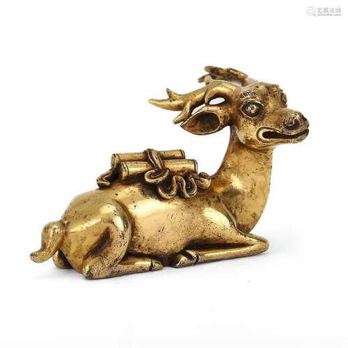 A BRONZE GILT DEER-SHAPED ORNAMENT