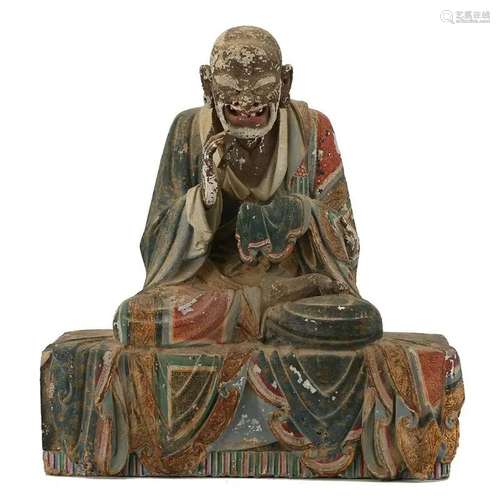 A POLYCHROME PAINTED CLAY FIGURE OF A LUOHAN