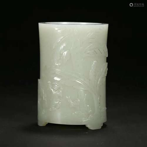 A CELADON JADE 'FIGURE' BRUSHPOT