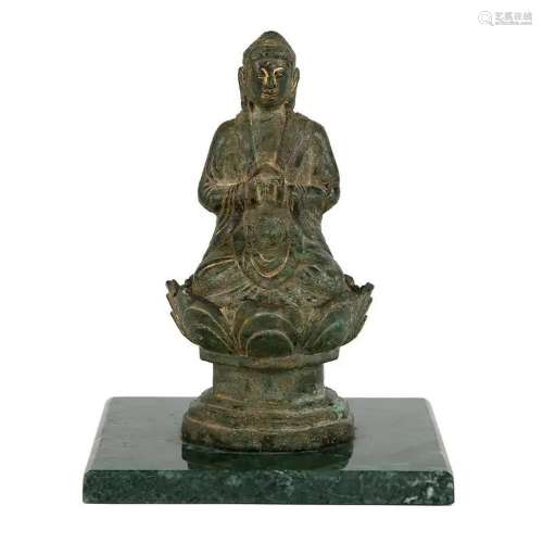 AN IRON SHAKYAMUNI BUDDHA SEATED FIGURE