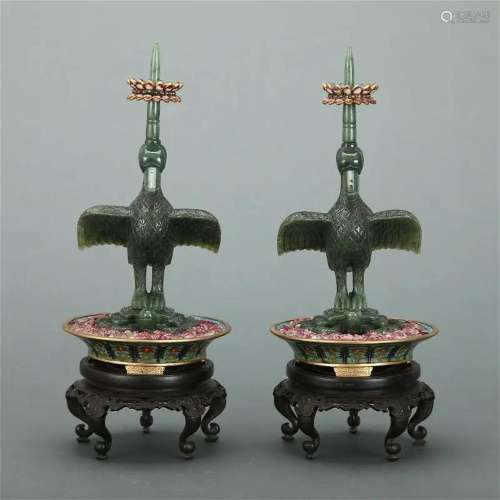 A PAIR OF DARK GREEN JADE 'CRANES' CANDLE HOLDERS