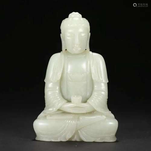 A WHITE JADE SEATED FIGURE OF SHAKYAMUNI BUDDHA