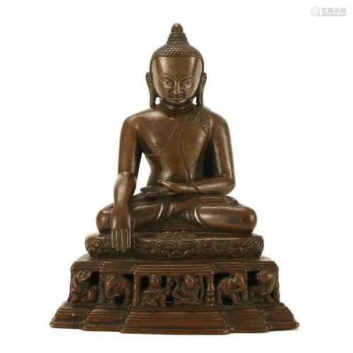 A BRONZE SEATED FIGURE OF SHAKYAMUNI BUDDHA