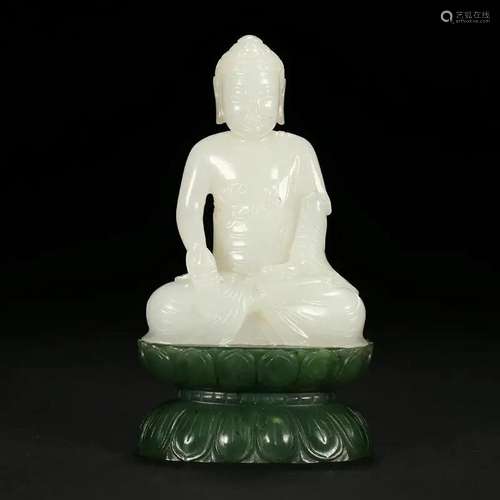 A WHITE JADE SEATED FIGURE OF SHAKYAMUNI BUDDHA