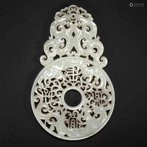 A WHITE JADE CARVED DRAGON PENDANT