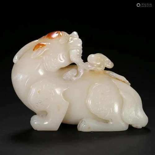 A WHITE JADE BEAST CARVING