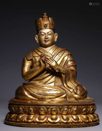 In the Qing Dynasty, the bronze gilded statue of Guru Karmap...
