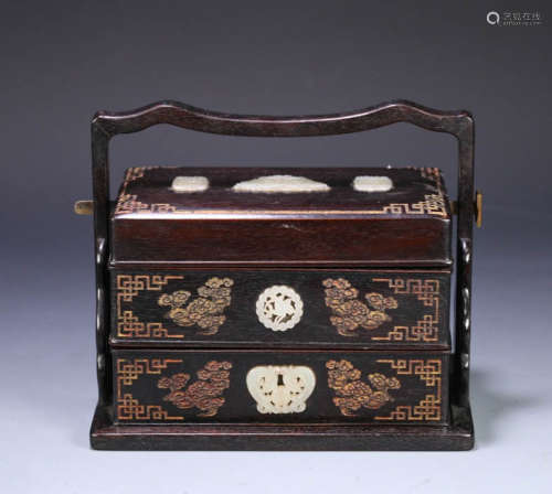 In the Qing Dynasty, red sandalwood inlaid with Hotan Jade f...