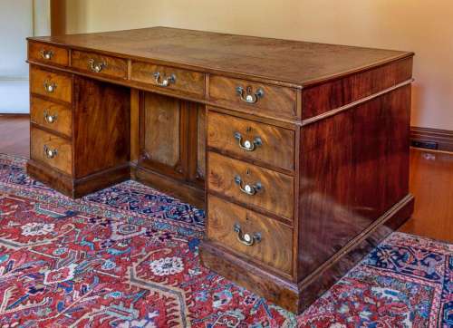 A very rare George III mahogany and ivory-inlaid rent desk, ...