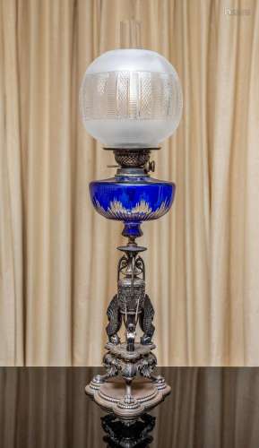 A Victorian sterling silver and blue-glass oil lamp,by Frede...