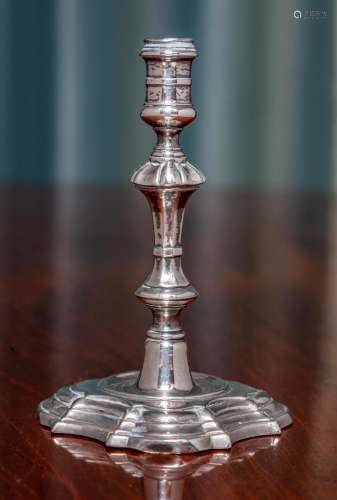 A George II cast silver taper-stick, makers mark indistinct ...